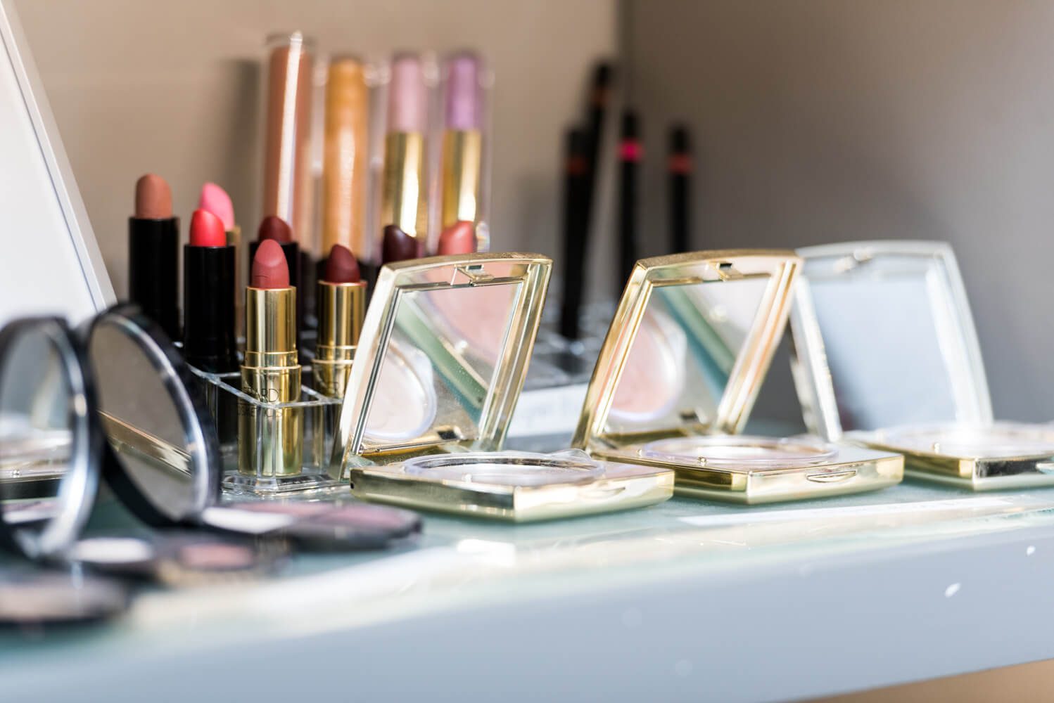 Make up products on vanity table close up